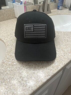 Caterpillar Black  Hat with Gray Flag Patch